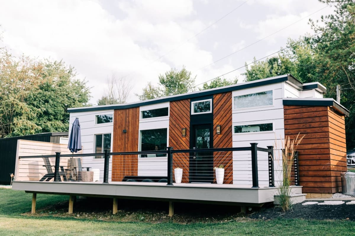 The Lux tiny home and deck in daylight