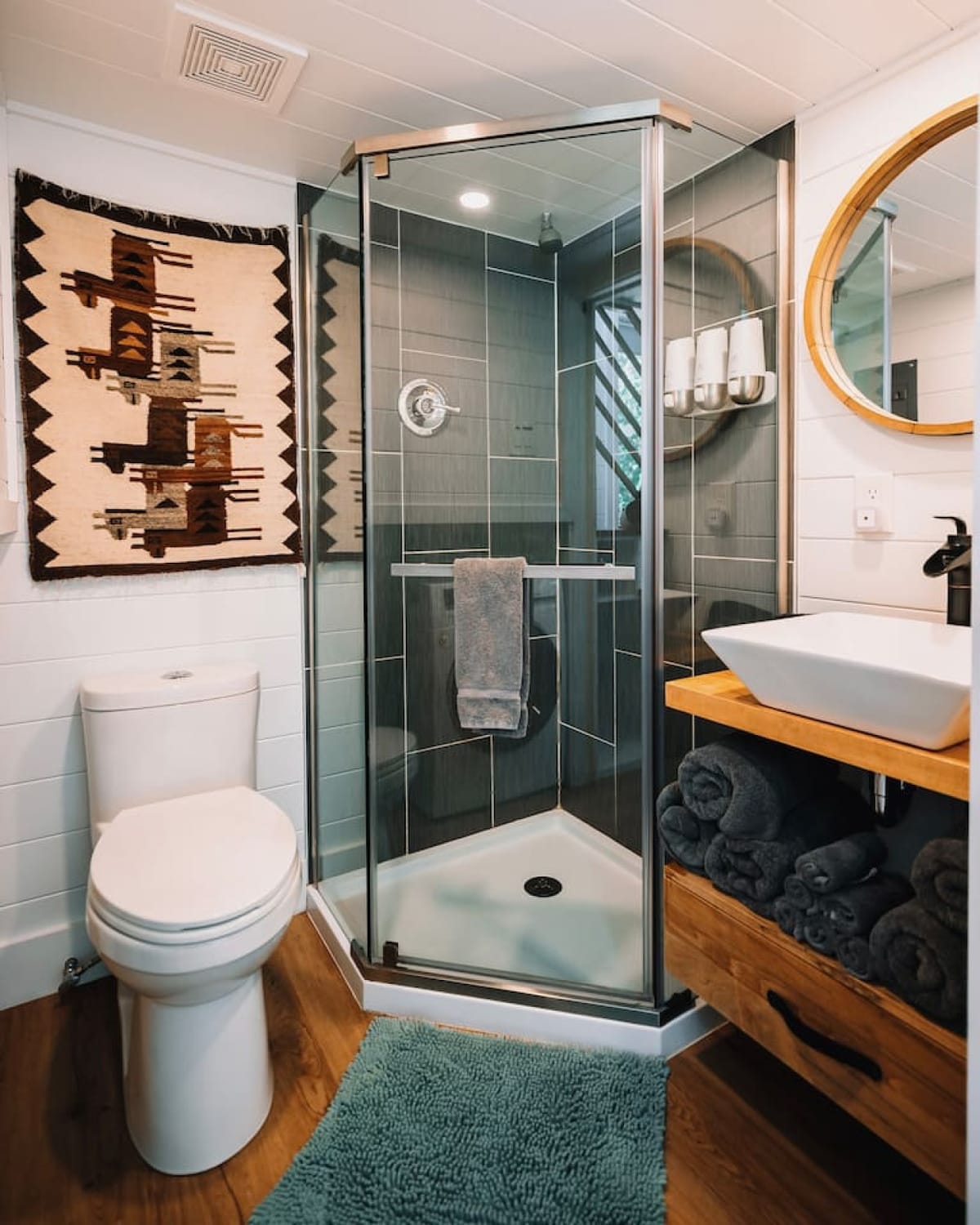 The full bathroom in The Scandi with a glass shower and vessel sink