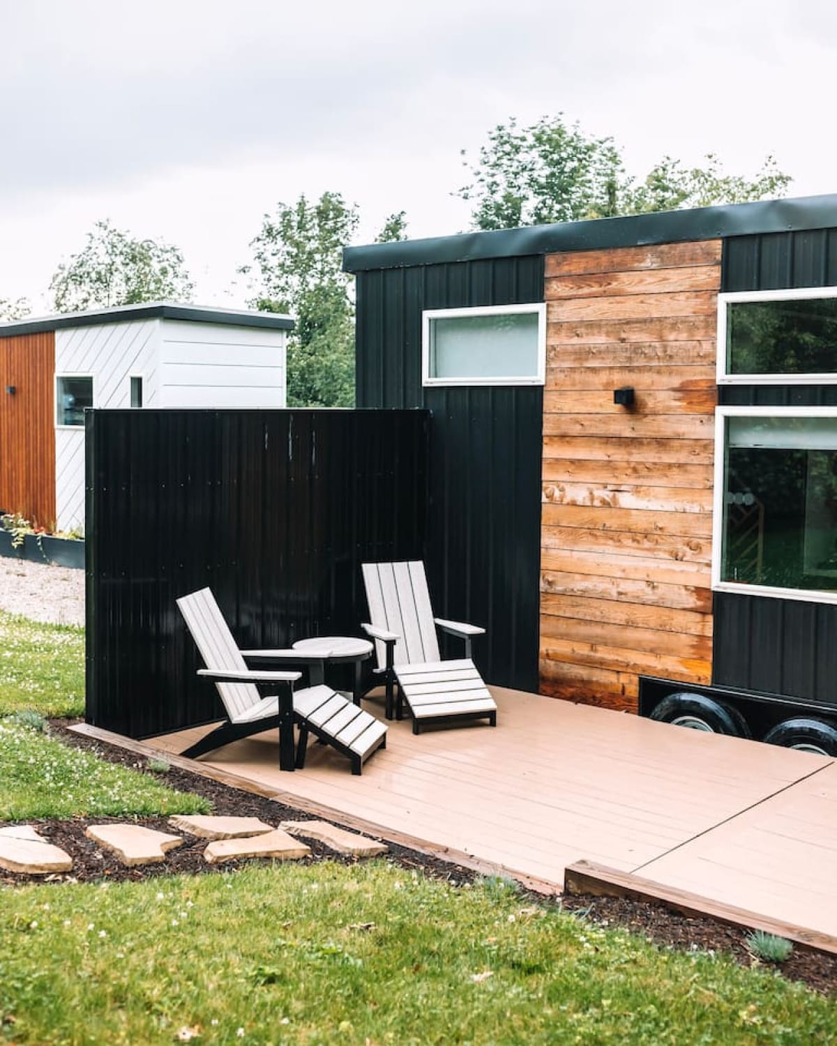 Adirondack chairs on the deck of The Scandi tiny home