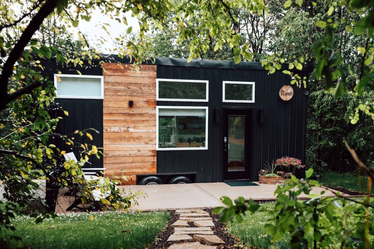 The Scandi tiny home on its wooded lot near Berlin, Ohio